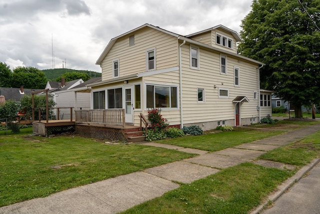 exterior space with a wooden deck and a front lawn