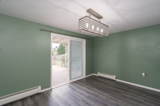 unfurnished room with dark wood-type flooring, a baseboard radiator, and a textured ceiling