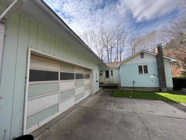 view of side of property with a garage