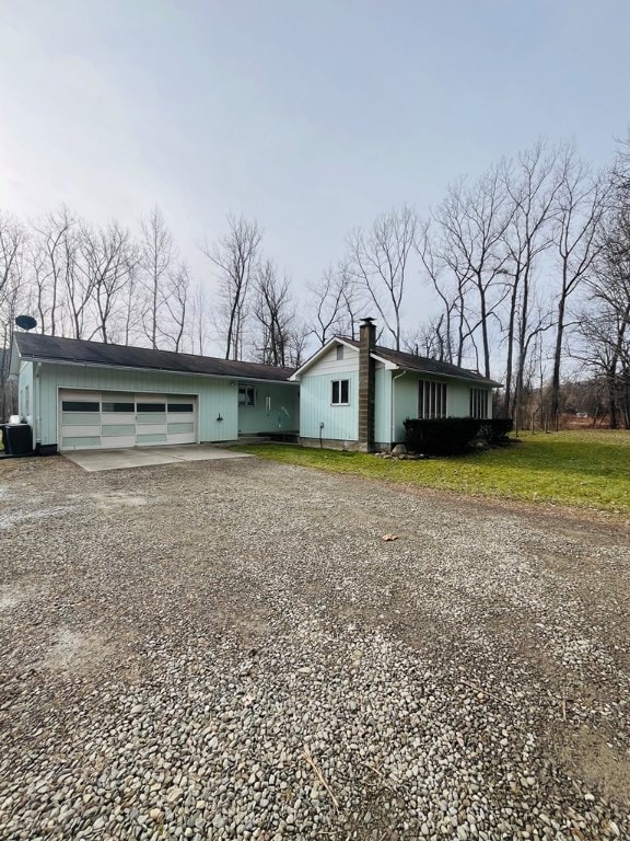 ranch-style house featuring a garage