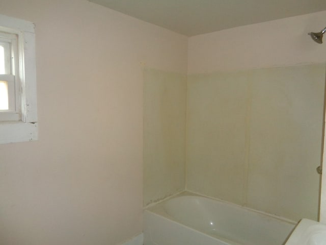 bathroom with shower / washtub combination