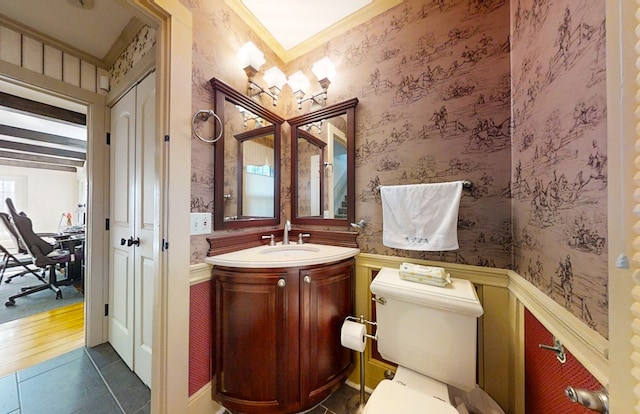 bathroom featuring ornamental molding, vanity, tile patterned floors, and toilet