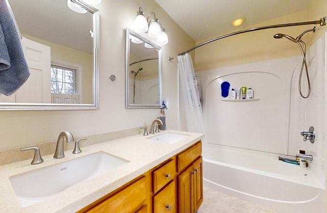 bathroom featuring shower / tub combo and vanity