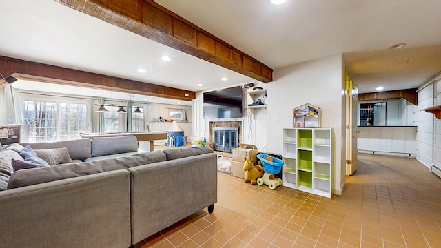 living room with baseboard heating, a fireplace, and beam ceiling