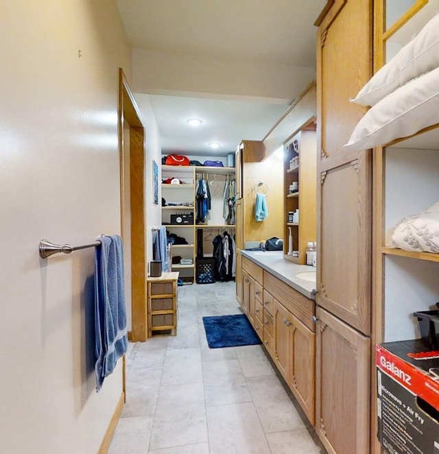 bathroom featuring tile patterned floors and vanity