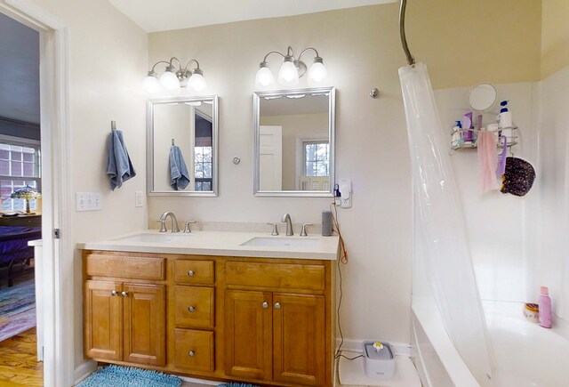 bathroom with vanity and shower / bathtub combination with curtain