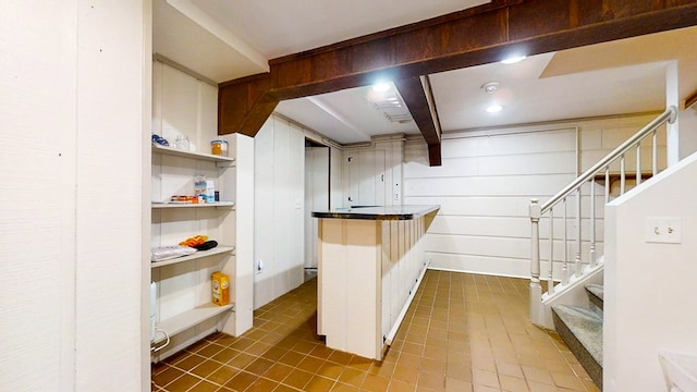 kitchen featuring wood walls