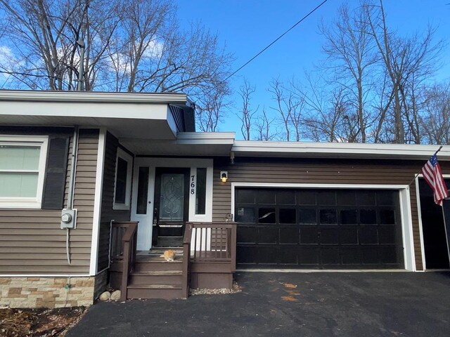 view of exterior entry featuring a garage