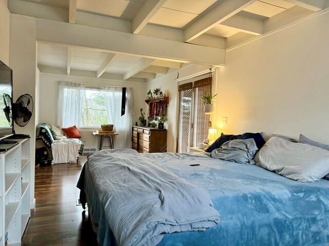 bedroom with dark wood-type flooring and beamed ceiling