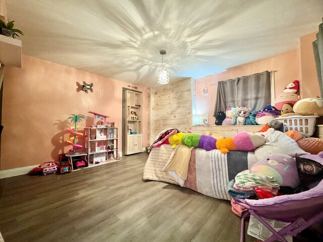 bedroom with wood-type flooring