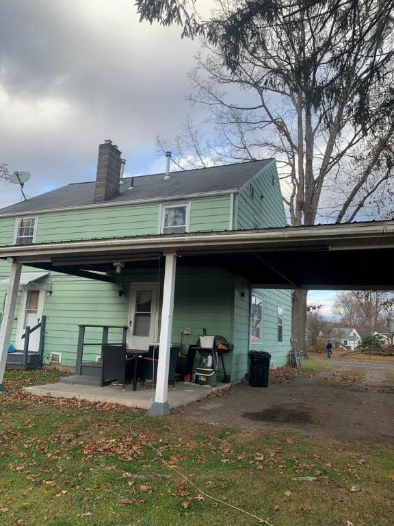 back of property featuring a patio