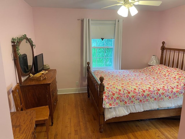 bedroom with hardwood / wood-style floors and ceiling fan