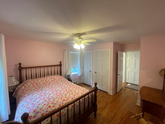 bedroom with hardwood / wood-style floors and ceiling fan