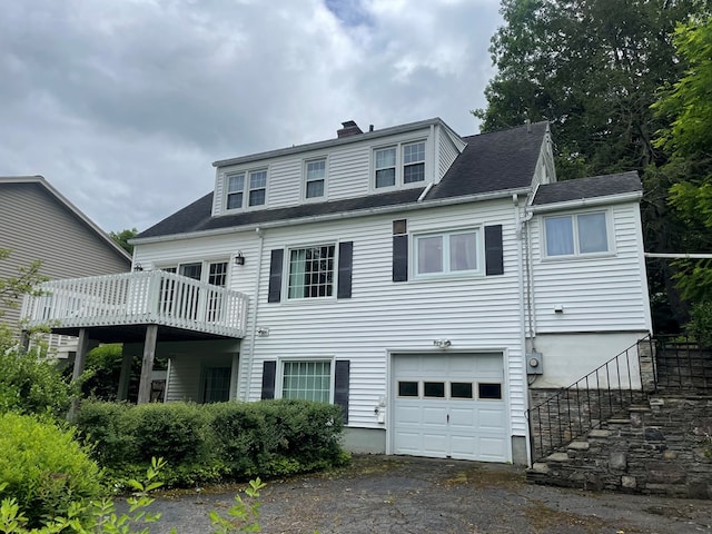 back of house with a garage