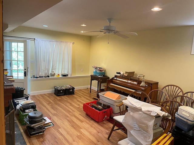 misc room with ceiling fan and light hardwood / wood-style flooring