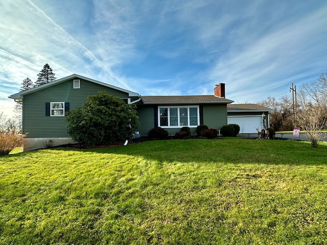 view of front facade with a garage and a front yard