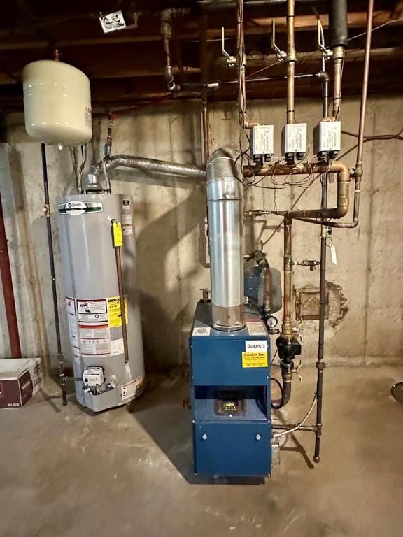 utility room featuring gas water heater