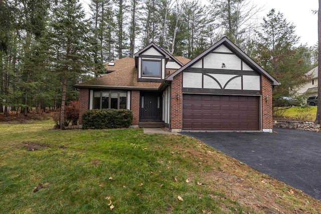 view of front facade with a garage and a front lawn