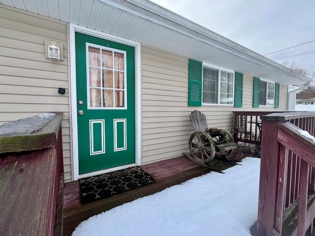 view of snow covered property entrance