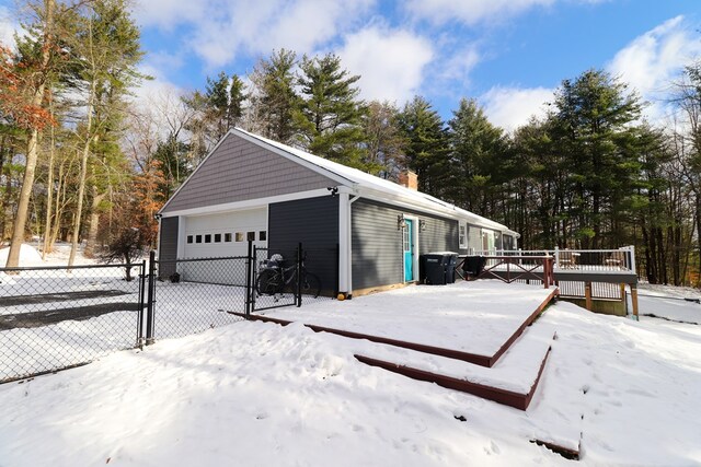 view of snow covered garage