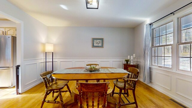 dining area with light hardwood / wood-style flooring