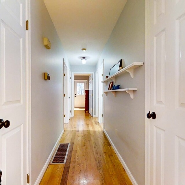 hallway featuring light wood-type flooring