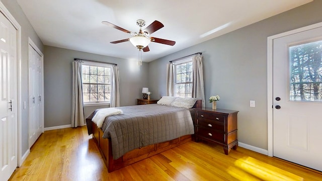 bedroom with ceiling fan and light hardwood / wood-style floors