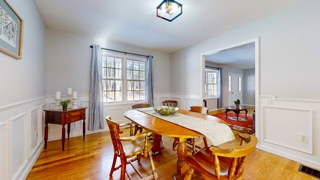 dining area with light hardwood / wood-style floors