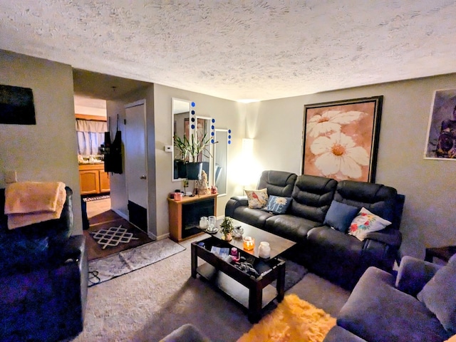 living room with light colored carpet and a textured ceiling