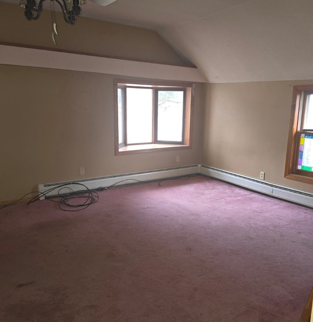 additional living space featuring lofted ceiling, a baseboard radiator, and carpet