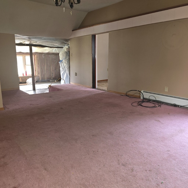 interior space featuring a baseboard heating unit and light carpet