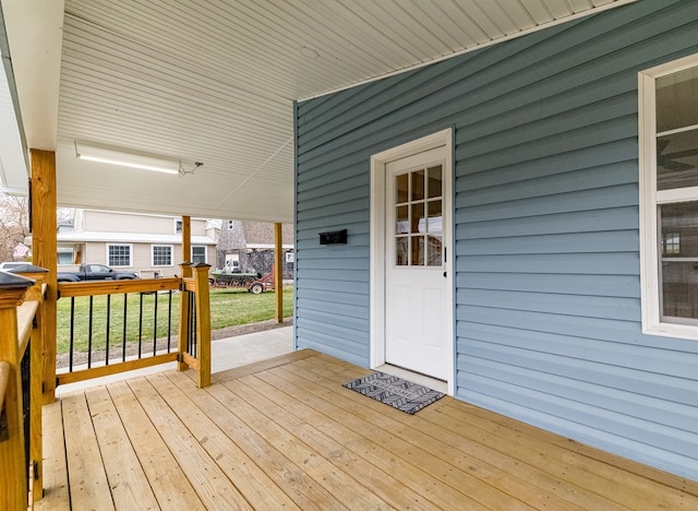 wooden deck with a yard