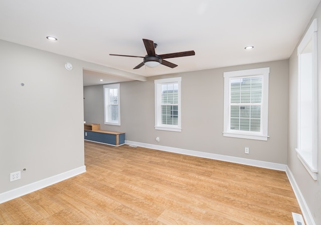 spare room with light hardwood / wood-style floors and ceiling fan