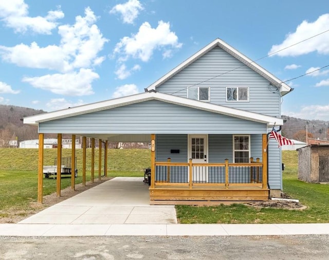 view of front of home with covered porch and a front lawn