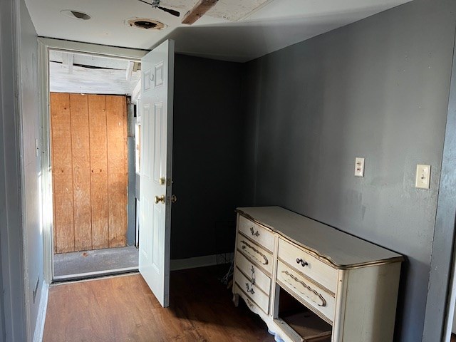 interior space featuring wooden walls and light wood-type flooring