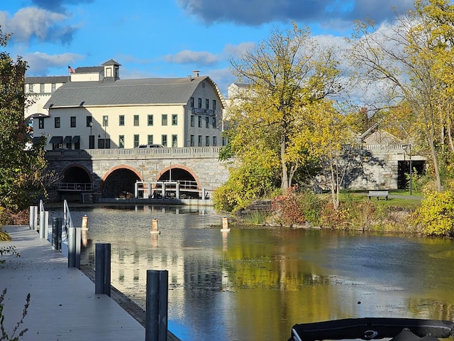 view of water feature with a dock