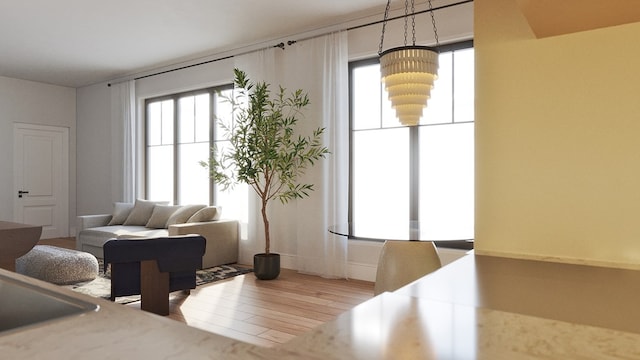 living room featuring hardwood / wood-style flooring and a notable chandelier