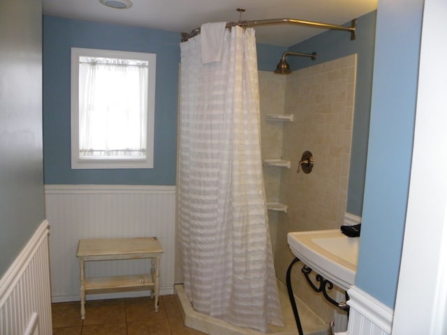 bathroom with tile patterned flooring and walk in shower