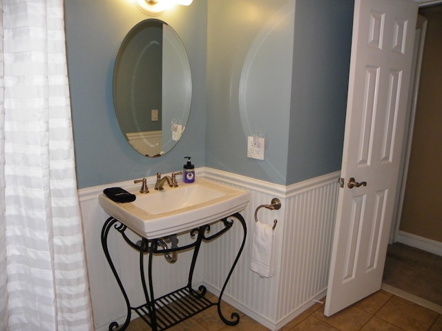 bathroom with tile patterned floors and sink