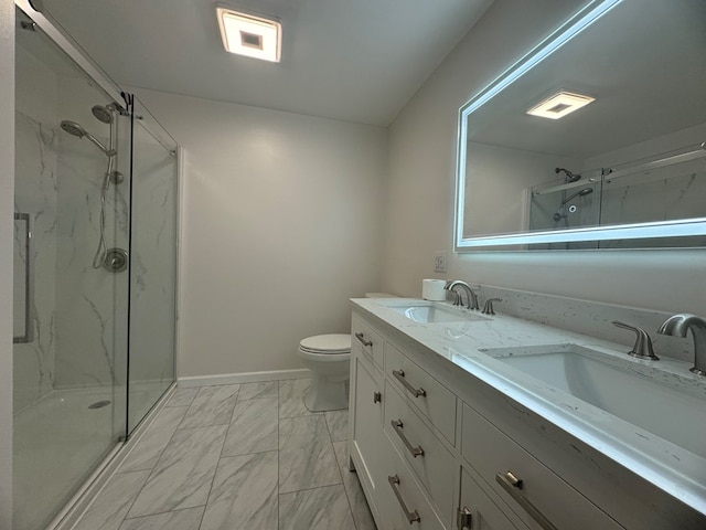 bathroom featuring vanity, an enclosed shower, and toilet