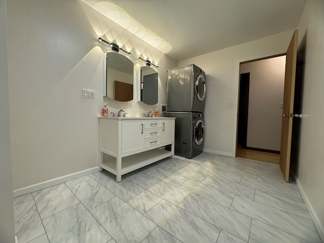 bathroom with vanity and stacked washing maching and dryer