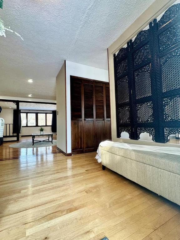 interior space with light hardwood / wood-style floors and a textured ceiling