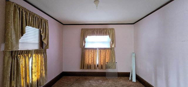 unfurnished room with crown molding