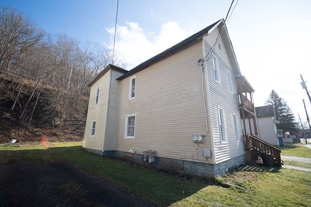 view of home's exterior featuring a lawn