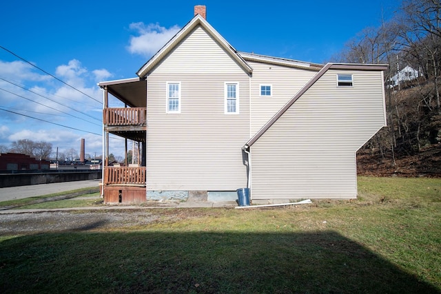 view of home's exterior featuring a yard