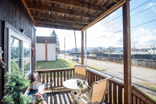 wooden deck with a shed