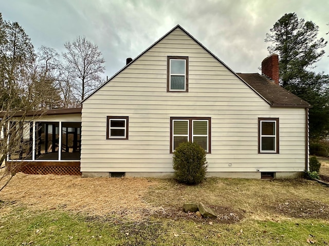 back of property featuring a sunroom