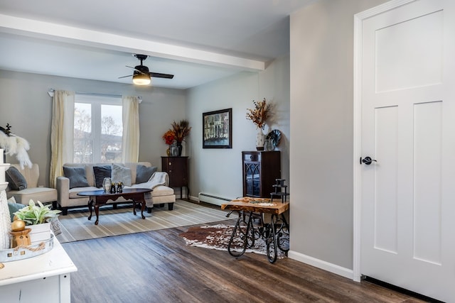 living room with beamed ceiling, ceiling fan, wood-type flooring, and a baseboard heating unit