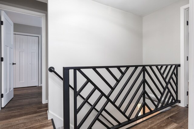 staircase with wood-type flooring