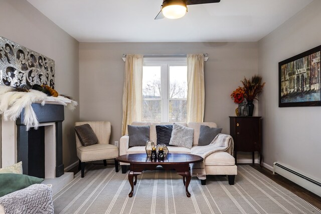 living room featuring a baseboard radiator and wood-type flooring